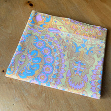 Load image into Gallery viewer, Vintage 1000 Nights poly cotton bed sheets featuring a bohemian geometric flower power design in shades of red, green, blue, pink, orange, yellow and white. Crafted by Dan River Mills, USA, 1970s. A beautiful addition to your retro boho bedding decor, or repurpose for crafting.
Both flat sheets are in excellent vintage condition, no stains/tears. The fitted sheet is in as found condition, loss of elasticity. Colours are vibrant.
Flat twin double sheet measures 80 x 94 inches