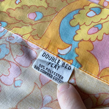 Load image into Gallery viewer, Vintage 1000 Nights poly cotton bed sheets featuring a bohemian geometric flower power design in shades of red, green, blue, pink, orange, yellow and white. Crafted by Dan River Mills, USA, 1970s. A beautiful addition to your retro boho bedding decor, or repurpose for crafting.
Both flat sheets are in excellent vintage condition, no stains/tears. The fitted sheet is in as found condition, loss of elasticity. Colours are vibrant.
Flat twin double sheet measures 80 x 94 inches