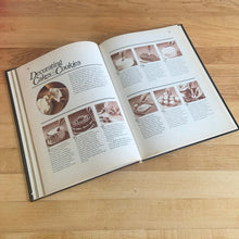 Load image into Gallery viewer, Better Homes and Gardens is known for its fabulous cookbooks. This hardcover cookbook focuses on All-Time Favourite Cake & Cookie Recipes. Its 96 pages are filled with amazing recipes along with many colour photographs. Originally published by Meredith Corporation, USA, 1980. This is the first edition printing. In great vintage condition with normal age-related yellowing.
