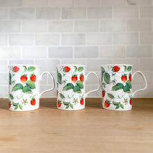 Load image into Gallery viewer, Side view of three Roy Kirkham Alpine Strawberry bone china mugs. displaying red strawberry and green leaf pattern