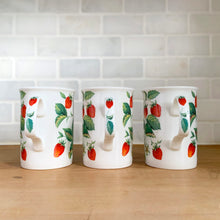 Load image into Gallery viewer, Handle view of three Roy Kirkham Alpine Strawberry bone china mugs. displaying red strawberry and green leaf pattern