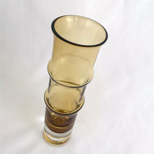 Load image into Gallery viewer, This vintage Bambu amber and clear bottom art glass vase is a prime example of iconic mid-century modern design. Designed by world–renowned artisan Bo Borgström in his inaugural year at Åseda Glasbruk, Sweden, 1961. A lovely vessel for a small floral bouquet and a great addition to a vintage art glass collection!
In excellent condition, no chips.
Measures 2 x 7 1/2 inches