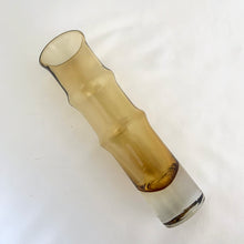 Load image into Gallery viewer, This vintage Bambu amber and clear bottom art glass vase is a prime example of iconic mid-century modern design. Designed by world–renowned artisan Bo Borgström in his inaugural year at Åseda Glasbruk, Sweden, 1961. A lovely vessel for a small floral bouquet and a great addition to a vintage art glass collection!
In excellent condition, no chips.
Measures 2 x 7 1/2 inches