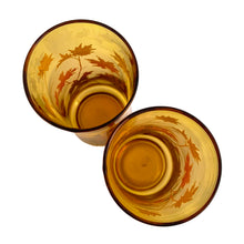 Load image into Gallery viewer, Vintage amber 16oz cooler glass tumbler decorated with maple leaves in brown, orange and yellow. Designed and crafted by the artisans at the Libbey Glass Company, USA, circa 1970s. You can almost taste the lemonade!
In excellent condition, free from chips/wear.
Measures 2 3/4 x 6 1/2 inches
Capacity 16 ounces