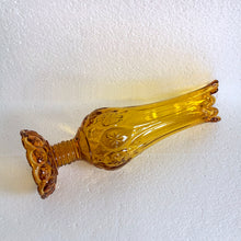Load image into Gallery viewer, Glow in the dark elegance! Show off your daring style with this vintage mid-century "Moon and Stars" art glass swung vase that glows under black light. Crafted from amber glass with a striking moon and stars design, this American-made Kanawha Glass vase would be an unforgettable addition to any decor! In excellent condition, free from chips/cracks. Measures 3 1/2 x 12 1/8 inches