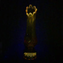 Load image into Gallery viewer, Glow in the dark elegance! Show off your daring style with this vintage mid-century "Moon and Stars" art glass swung vase that glows under black light. Crafted from amber glass with a striking moon and stars design, this American-made Kanawha Glass vase would be an unforgettable addition to any decor! In excellent condition, free from chips/cracks. Measures 3 1/2 x 12 1/8 inches