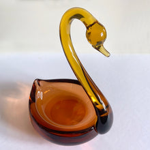 Load image into Gallery viewer, Vintage mid-century hand blown two-tone figural swan art glass candy dish with a rusty orange dish, graceful amber neck and beautifully polished bottom. This piece would have been crafted in either Murano Italy, or Czechoslovakia (possibly David Jones). A beautiful addition to any glass collection! In excellent condition, free from chips. Measures 7 3/4 x 6 1/4 x 9 3/4 inches