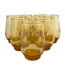 Load image into Gallery viewer, Set of 8 vintage amber Libbey Tempo 6 oz juice glasses arranged in a pyramid, front view