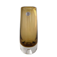 Load image into Gallery viewer, Vintage modernist amber glass vase featuring a clear base with bubble. Crafted by Magnor Glassverk, Norway, 1960s. A stunning piece of art glass to elevate your home's decor.
In excellent condition, no chips. Original tag.
Measures 2 3/4 x 7 1/8 inches