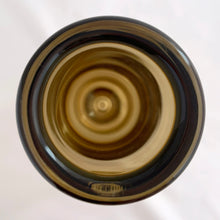 Load image into Gallery viewer, Vintage modernist amber glass vase featuring a clear base with bubble. Crafted by Magnor Glassverk, Norway, 1960s. A stunning piece of art glass to elevate your home's decor.
In excellent condition, no chips. Original tag.
Measures 2 3/4 x 7 1/8 inches