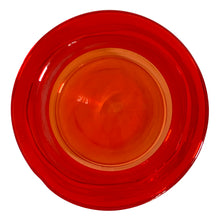 Load image into Gallery viewer, Striking vintage hand blown amberina apothecary canister jar with ground lid topped with an embossed flower detail. Takahashi Glass, Japan, circa 1970. This fabulous colour will liven up any room and it glows under black light!
In good vintage condition. There is chipping to the inside rim of the lid see photos. There are bubbles in the glass typical of the manufacturing process.
Measures 6 3/4 x 10 inches