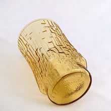 Load image into Gallery viewer, A charming set of four vintage mid-century modern honey gold "Pagoda" flat tumbler juice glasses made by the Anchor Hocking Glass Co. in the USA, circa 1960s-1970s. We love the distinct bark-like texture of this pattern. They're a perfect addition to any home! In excellent condition, no chips or cracks. Measures 2 3/8 x 3 3/4 inches Capacity 5 ounces