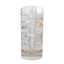 Load image into Gallery viewer, This stunning set of six mid-century era vintage highball glass tumblers are decorated with 22 karat gold angelfish and white seahorses, swimming in a frosted sea of waves with small stylized fish in gold and white in between scalloped gold borders. Crafted by Libbey Glass, USA, 1950s. These beauties will add an exquisite touch of Hollywood Regency style to any occasion - indulge your guests with these truly spectacular cocktail glasses while amping up the glam factor of your bar cart!