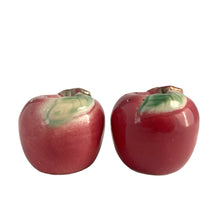 Load image into Gallery viewer, Sweet vintage mid-century era majolica style figural ceramic red apple salt and pepper shakers featuring brown branch and green leaves. Crafted by Metroware, Japan, circa 1940s. Perfect for adding kitsch style to your kitchen and table decor! In excellent used vintage condition, free from chips and new corks. Measures 2 3/8 x 2 1/4 inches