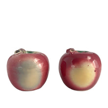 Load image into Gallery viewer, Sweet vintage mid-century era majolica style figural ceramic red apple salt and pepper shakers featuring brown branch and green leaves. Crafted by Metroware, Japan, circa 1940s. Perfect for adding kitsch style to your kitchen and table decor! In excellent used vintage condition, free from chips and new corks. Measures 2 3/8 x 2 1/4 inches