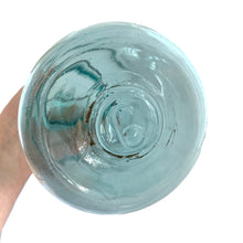 Load image into Gallery viewer, Vintage Perfect Seal aqua glass mason jar,featuring glass lid and wire bail closure. Produced by the Hamilton Glass Works in the early 20th century. These jars are fabulous for storing dry goods or may be repurposed as a vase. Perfect for farmhouse and cottage core decor. In as found condition. Measures 4 1/2 x 9 1/2 inches Capacity 2 quarts (1/2 gallon)