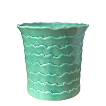 Load image into Gallery viewer, Side view of vintage wave ceramic planter displaying aqua to seafoam green reactive glaze gradient