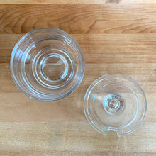 Load image into Gallery viewer, Vintage Joe Colombo modernist clear glass covered sugar bowl. Arno, Italy, 1960s. This sleek mid century modernist geometric design has a silhouette which makes the contents in this pressed glass appear suspended above the table surface.
In excellent condition, free from chips. Marked on the bottom ITALY and Arno stamp.
Measures 3 3/8 x 3 3/8 x 3 3/8 inches