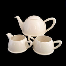 Load image into Gallery viewer, Lovely art deco vintage Everhot teapot with brewing basket and insulated chrome-plated steel beehive style cover with coordinating, creamer and sugar. The steel covers are easily removed for ease of cleaning. Crafted by Perry, Bevan and Co., England, 1940s - 1960s. A distinctive set for your next high tea party!
All pieces are in good used vintage condition with crazing present. The creamer shows minor wear to the spout but no chips and the sugar has some minor staining. The chrome is gorgeous!