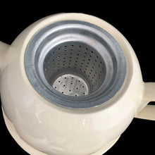 Load image into Gallery viewer, Lovely art deco vintage Everhot teapot with brewing basket and insulated chrome-plated steel beehive style cover with coordinating, creamer and sugar. The steel covers are easily removed for ease of cleaning. Crafted by Perry, Bevan and Co., England, 1940s - 1960s. A distinctive set for your next high tea party!
All pieces are in good used vintage condition with crazing present. The creamer shows minor wear to the spout but no chips and the sugar has some minor staining. The chrome is gorgeous!