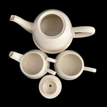 Load image into Gallery viewer, Lovely art deco vintage Everhot teapot with brewing basket and insulated chrome-plated steel beehive style cover with coordinating, creamer and sugar. The steel covers are easily removed for ease of cleaning. Crafted by Perry, Bevan and Co., England, 1940s - 1960s. A distinctive set for your next high tea party!
All pieces are in good used vintage condition with crazing present. The creamer shows minor wear to the spout but no chips and the sugar has some minor staining. The chrome is gorgeous!