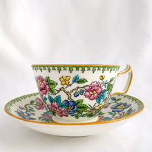 Load image into Gallery viewer, Vintage hand painted, multi-colour Asian rose flowered teacup in the Chinoiserie style is a rare pattern produced by Hammersley and Company, Bone China, England, circa 1940s. Painted in the interior and exterior, the flowers are shades of blue, pink, yellow and green featuring a pair of scrolls tied with a pink bow. Makes a lovely gift for any occasion. Excellent condition, free from chips, cracks or repairs. Teacup measures3 1/2 x 2 1/4 inches. Saucer measures 5 1/4 inches