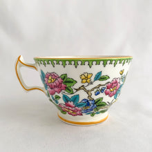 Load image into Gallery viewer, Vintage hand painted, multi-colour Asian rose flowered teacup in the Chinoiserie style is a rare pattern produced by Hammersley and Company, Bone China, England, circa 1940s. Painted in the interior and exterior, the flowers are shades of blue, pink, yellow and green featuring a pair of scrolls tied with a pink bow. Makes a lovely gift for any occasion. Excellent condition, free from chips, cracks or repairs. Teacup measures3 1/2 x 2 1/4 inches. Saucer measures 5 1/4 inches