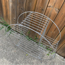 Load image into Gallery viewer, Vintage mid-century Art Deco wire circular hoop plant stand in silver with ball feet. Perfect for displaying plants, books and decor. Add atomic flair to your indoor or outdoor decor with this piece crafted in the 1950s. In excellent vintage condition. Shows signs of age, and has some wear spots. Measures 24 x 10 x 27 inches