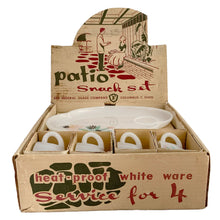 Load image into Gallery viewer, This delightful vintage mid-century era Atomic Flower eight piece milk glass snack plate and cup set captures the perfect balance between classic style and sophistication. The plates are offset oval shaped and both plate and cup feature a sweet pattern of florals in shades of turquoise, pink, yellow and black. Crafted by Federal Glass, USA, circa 1950s. New old stock in original box. In like-new vintage condition, no chips, cracks or wear.
Snack plates measure 7x10 inches Cups measure 3 1/4x2 1/2 inches