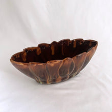 Load image into Gallery viewer, Vintage oval shaped redware pottery planter, finished with Aurora Borealis drip glaze in tones of brown, toffee and green on a lily pattern. Produced by CCC Pottery, Canada, circa 1960s. In excellent condition, free from cracks/repairs. A couple of minor flea bites to the rim which aren't too noticeable thanks to the colour of the redware. Measures 8 3 1/8 x 3 1/8 inches