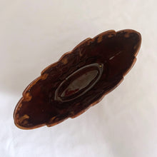Load image into Gallery viewer, Vintage oval shaped redware pottery planter, finished with Aurora Borealis drip glaze in tones of brown, toffee and green on a lily pattern. Produced by CCC Pottery, Canada, circa 1960s. In excellent condition, free from cracks/repairs. A couple of minor flea bites to the rim which aren't too noticeable thanks to the colour of the redware. Measures 8 3 1/8 x 3 1/8 inches