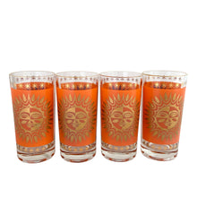 Load image into Gallery viewer, Close-up of four vintage Celestial Aztec Sun highball glasses showing detailed orange geometric sun face pattern with 22K gold rim and base decoration