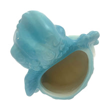 Load image into Gallery viewer, Vintage baby boy ceramic planter, shape 92. This sweet planter features a baby boy in blue diaper holding a rattle, leaning against a blue ruffled edged pillow. Crafted by Hull Pottery, USA, 1950s. Perfect for a houseplant or to use as nursery decor or as a practical holder for baby's accessories. In excellent condition, no chips. Measures 5 1/4 x 4 1/2 x 5 1/2 inches