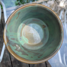 Load image into Gallery viewer, Vintage blended exotic brown glazed Bamboo ceramic planter with attached saucer from the Green Thumb Line. Crafted by McCoy Pottery, 1970s. A hard-to-find planter in a rare glaze. A must have for any art pottery collector. A sweet piece for your favourite houseplant or succulent.
In excellent vintage condition, no chips/cracks/repairs, typical age-related crazing and manufacturer's glaze pops. Maker's marks.
Measures 5 1/2 x 4 1/2 inches