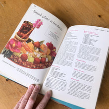 Load image into Gallery viewer, Better Homes and Gardens is known for its fabulous cookbooks. This hardcover cookbook focuses on barbeque and picnic inspired recipes. Its 61 pages are filled with amazing recipes along with many colour photographs. Originally published by Meredith Corporation, USA, 1963. This is the first edition. In great vintage condition with normal age-related yellowing.
