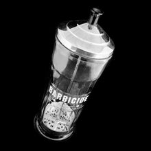 Load image into Gallery viewer, Originally created by a science teacher, this fantastic vintage Barbicide pressed glass canister jar has been the trusted vessel for holding germicide and disinfectant for over 75 years! These jars are in every barber and hair stylists shops to disinfect scissors, combs and other hair care tools. Use as intended or repurpose to hold straws for a fun diner vibe! Measures 4 1/4 x 11 inches. Marked "King Research Inc. 4754 Made in Canada". Capacity of 32 ounces