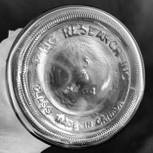 Load image into Gallery viewer, Originally created by a science teacher, this fantastic vintage Barbicide pressed glass canister jar has been the trusted vessel for holding germicide and disinfectant for over 75 years! These jars are in every barber and hair stylists shops to disinfect scissors, combs and other hair care tools. Use as intended or repurpose to hold straws for a fun diner vibe! Measures 4 1/4 x 11 inches. Marked "King Research Inc. 4754 Made in Canada". Capacity of 32 ounces