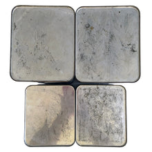 Load image into Gallery viewer, Overhead view of 4 vintage BeautyWare chrome canister bottoms showing embossed script mark and age wear