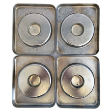 Load image into Gallery viewer, Underside of 4 vintage BeautyWare chrome canister lids showing circular knob mounts and patina