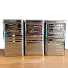 Load image into Gallery viewer, Front view of Vintage Lincoln BeautyWare 4-piece chrome kitchen canister set, embossed Flour Sugar Coffee Tea lettering, ribbed steel, 1940s USA