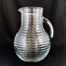 Load image into Gallery viewer, Side profile of vintage Bormioli Rocco beehive ribbed pressed glass pitcher, 6 × 8⅜ inches, Italy