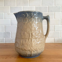 Load image into Gallery viewer, Vintage art deco gloss beige blue fade ceramic yellow ware pitcher featuring climbing roses on a trellis pattern. Crafted by McCoy Pottery, USA, 1920s. A beautiful piece to add to your art pottery collection!
In excellent condition, no chips/cracks/repairs, age-related crazing. Typical manufacturing glaze pops. Unmarked.
Measures 7 x 7 7/8 inches incl. handle