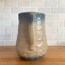 Load image into Gallery viewer, Vintage art deco gloss beige blue fade ceramic yellow ware pitcher featuring climbing roses on a trellis pattern. Crafted by McCoy Pottery, USA, 1920s. A beautiful piece to add to your art pottery collection!
In excellent condition, no chips/cracks/repairs, age-related crazing. Typical manufacturing glaze pops. Unmarked.
Measures 7 x 7 7/8 inches incl. handle