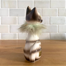 Load image into Gallery viewer, Super funky vintage anthropomorphic hand painted big yellow eyed striped cat ceramic figurine, sporting a fur collar and bell. Sticker indicates Ozark Souvenir, West Plains, MO. Crafted in Japan, 1950s. A great addition to your kitschy cat collection! In excellent vintage condition, no chips, minor wear to the red cold paint on the nose. Measures 2 1/4 x 1 5/8 x 4 3/4 inches