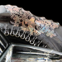 Load image into Gallery viewer, Vintage mid-century era 3-part clear glass relish dish, graced with a stunning silver overlay of birds perched on grapevines with saw tooth rim. Silver City, USA, 1950s. A stunning piece to serve your favourite sweet or savory treats!
In excellent condition, no chips. The silver overlay is intact with patina.
Measures 8 x 8 x 2 inches