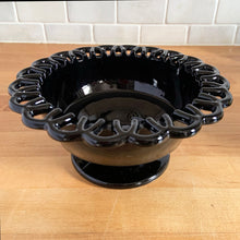 Load image into Gallery viewer, This vintage black amethyst glass compote was manufactured by the L. E. Smith Glass Company, USA. In the 1930s it was listed as No. 44 and in the mid-century 1950s line, it was renamed to the "Colonial Lace" pattern. When held up to a strong light, you'll be able to see the amethyst colour. this piece makes a great catchall, or fill it with your favourite candies. In excellent condition, free from chips/cracks. Measures 7 1/8 x 3 3/8 inches