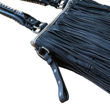 Load image into Gallery viewer, Vintage boho style black faux leather purse with fringe detail, tan interior with one zippered and two open pockets, snap closure. Crafted by Steve Madden.
In as found vintage condition with overall wear, interior is stained, see photos.
Measurements with handles 13 x 28 inches
Measurements without handles 13 x 16 1/2 inches