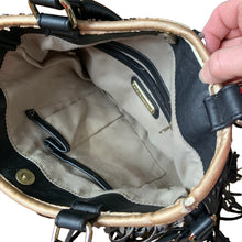 Load image into Gallery viewer, Vintage boho style black faux leather purse with fringe detail, tan interior with one zippered and two open pockets, snap closure. Crafted by Steve Madden.
In as found vintage condition with overall wear, interior is stained, see photos.
Measurements with handles 13 x 28 inches
Measurements without handles 13 x 16 1/2 inches