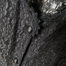Load image into Gallery viewer, Vintage gothic boho style mid-length black floral lace Kaftan buttoned coat dress with lace up cinching tie at the back and slip dress, size 11. Lace dress is 60% nylon, 40%rayon. Slip is 100% polyester. Crafted by Dawn Joy Fashions, USA, 1980s.
In excellent condition, no tears/stains.
Size 11
Measurements
Shoulders 17 inches
Bust 17 inches
Waist 16
Hip 20 inches
Length 50 1/2 inches