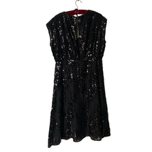 Load image into Gallery viewer, Classic sleeveless black sequined cocktail dress with V neck, split back, flared skirt, size 12. Dress and lining are 100% polyester. RW & CO.
In excellent condition, no tears/stains. Hand wash in cold, hang to dry.
Size 12
Measurements
Shoulders 16 inches
Bust 23 inches
Waist 16 1/2
Hip 22 inches
Length 44 inches
